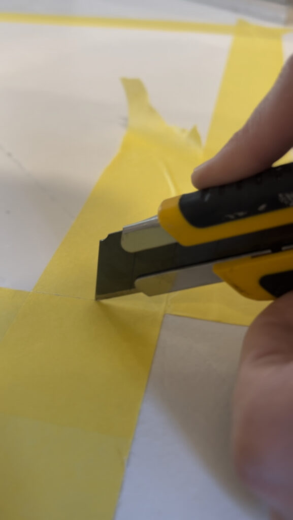 Cutting the excess tape.
