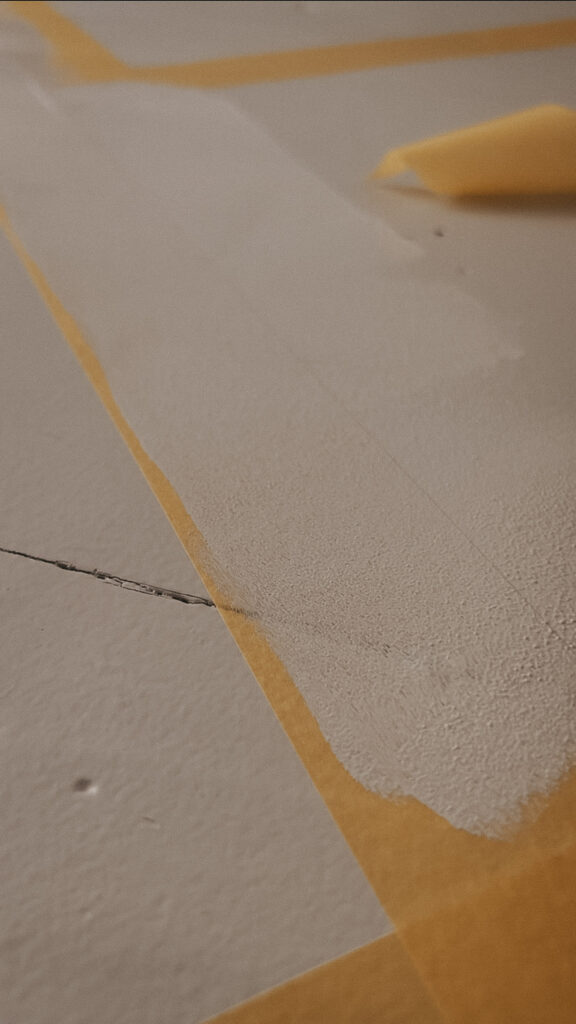 Painting over the tape line to seal (for the crispest finished product).