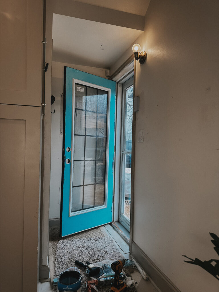 Image of door with new window installed (before being painted).