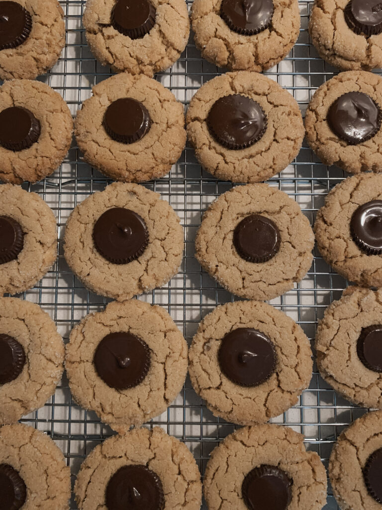 Image of fresh peanut butter cookies with dark chocolate peanut butter cup on top - perfect for a sweet holiday appetizer!